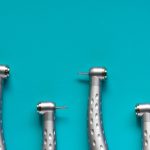Flat lay of dental high-speed handpieces on the blue background
