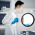 Man, scientist and laboratory autoclave equipment for medicine temperature control, medical researc